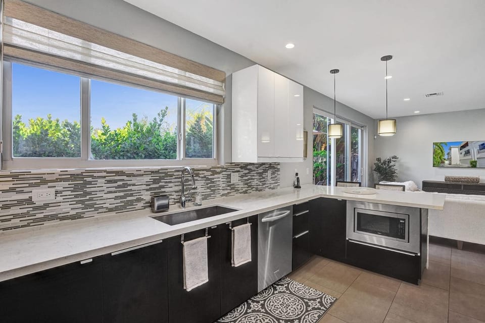 Kitchen or kitchenette, dishwasher, microwave, oven, stove