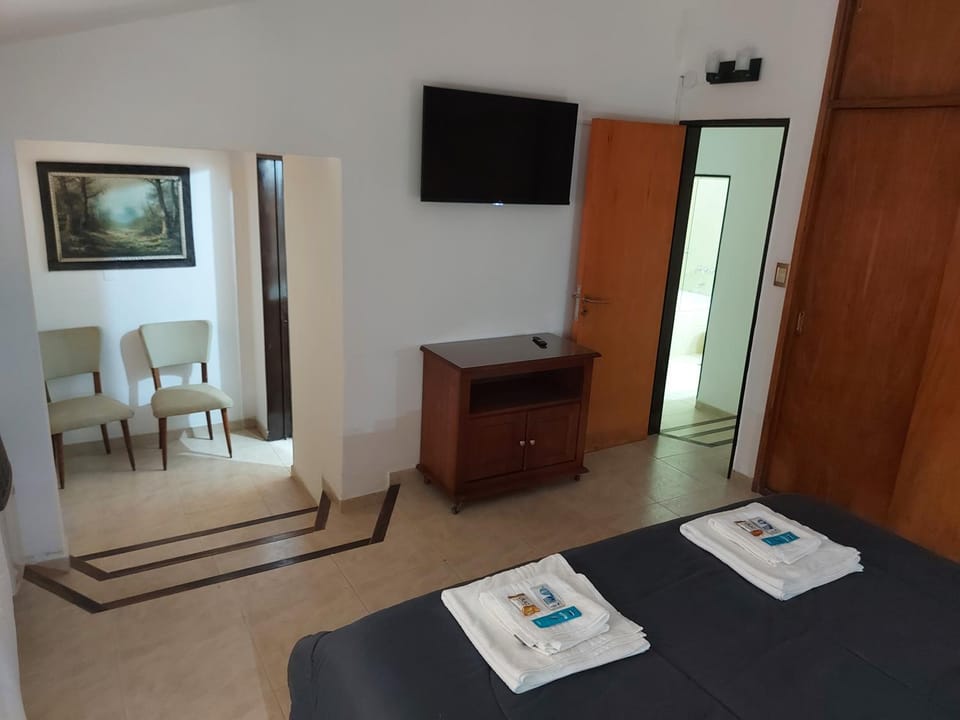 Bed, TV and multimedia, Seating area, Bedroom