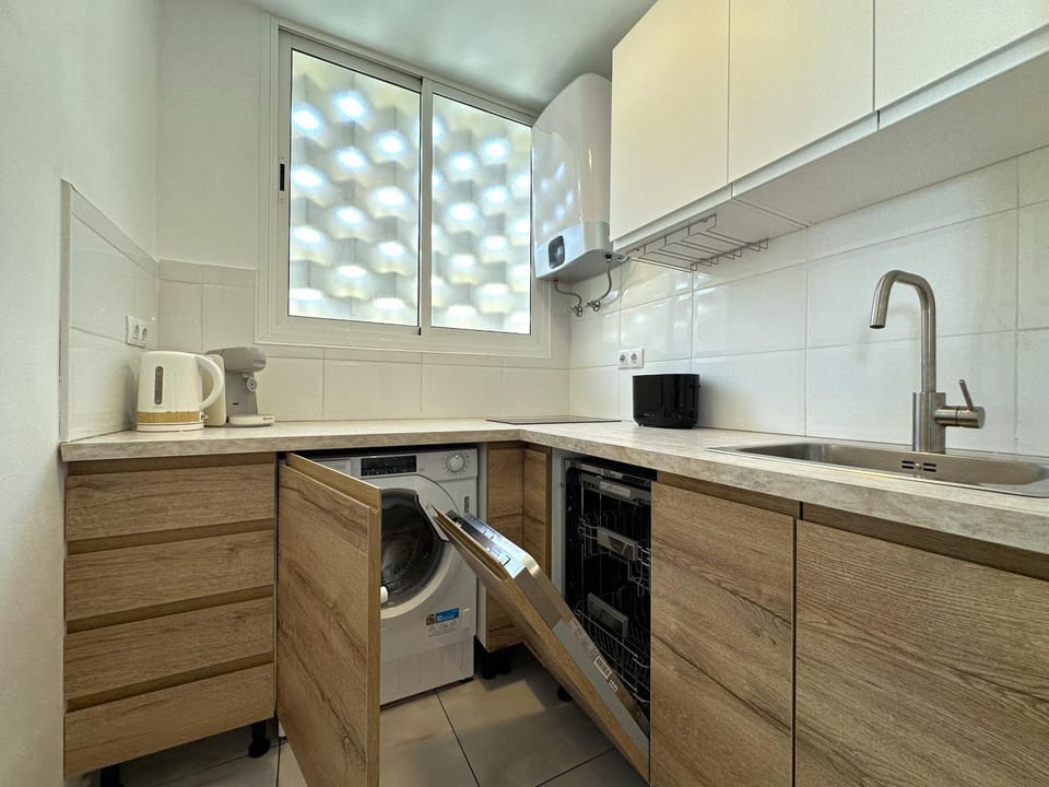 Kitchen or kitchenette, dishwasher, stove, toaster, washing machine