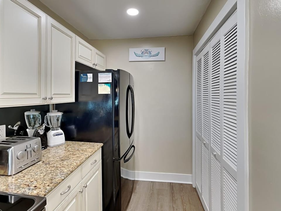 Kitchen or kitchenette, furniture, microwave, stove, wardrobe