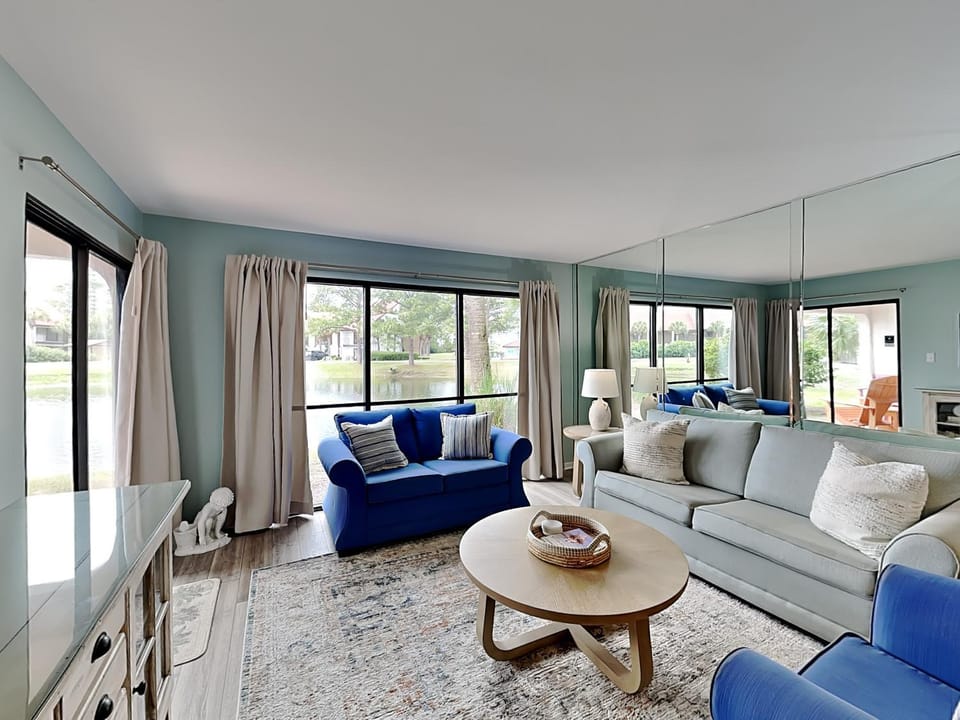 View (from property/room), Living room, Seating area, Lake view, furniture