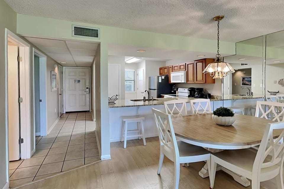 Kitchen or kitchenette, Dining area, furniture, microwave, air conditioner