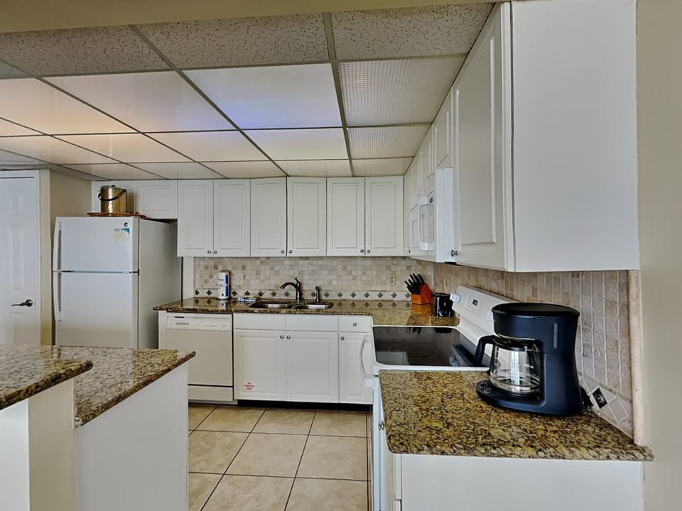 Kitchen or kitchenette, dishwasher, microwave, oven, stove, kitchen