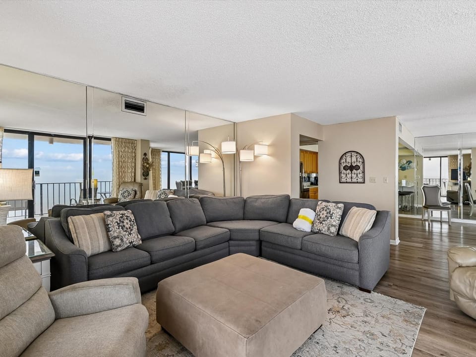 View (from property/room), Living room, Seating area, Sea view, furniture, air conditioner