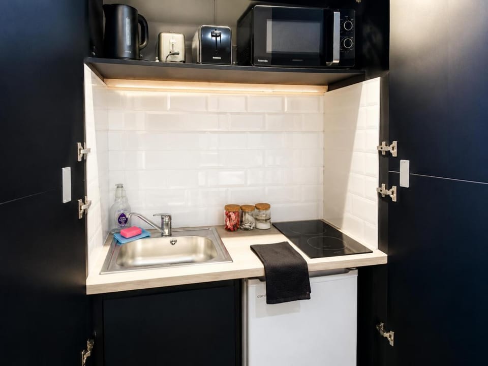 Kitchen or kitchenette, oven, stove, toaster