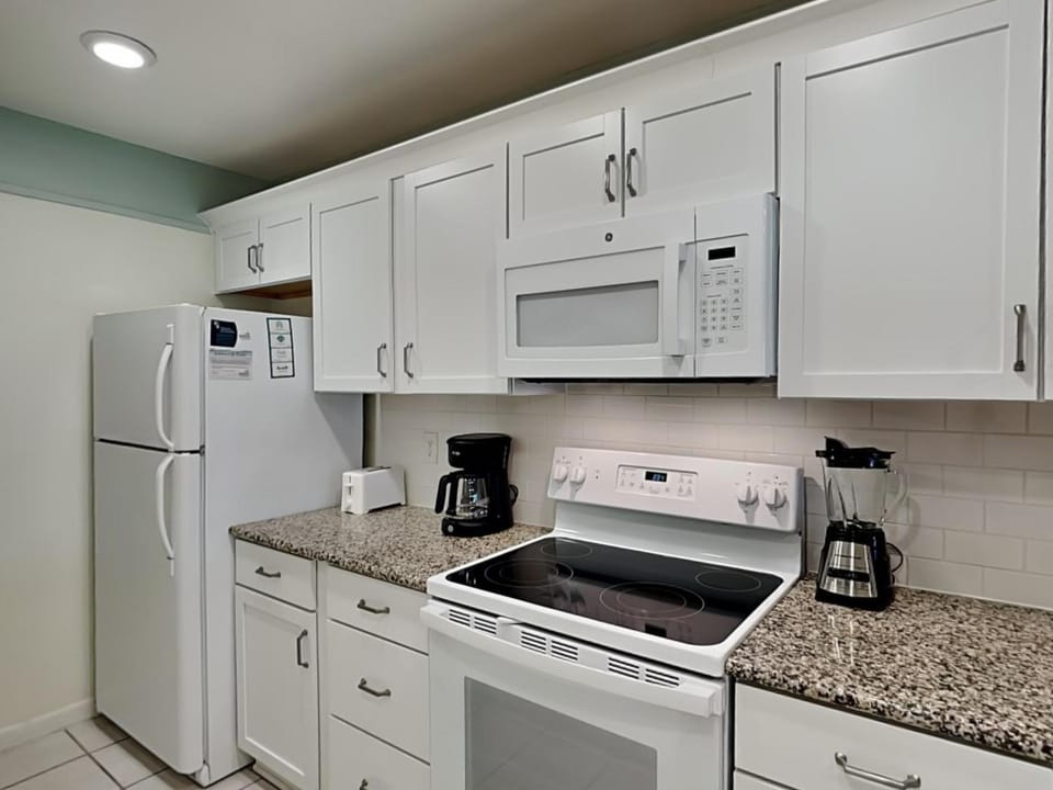 Kitchen or kitchenette, microwave, oven, stove, toaster, kitchen