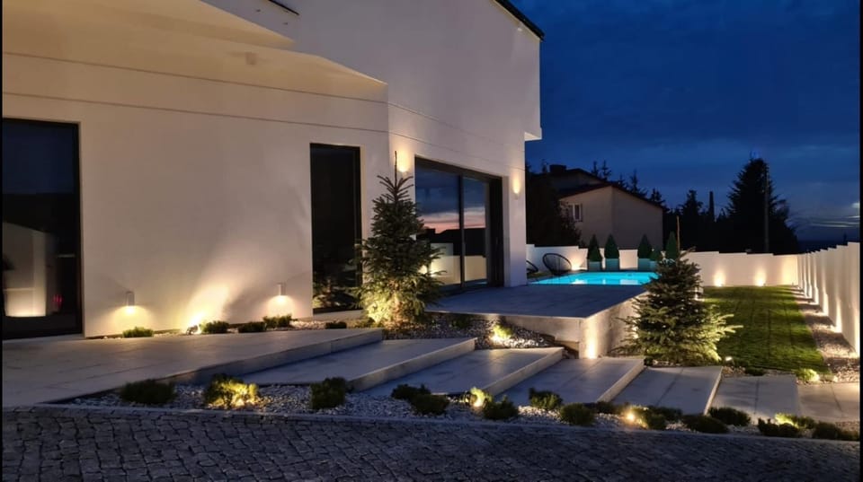 Property building, Patio, Night, Garden, Garden view, Pool view, Swimming pool