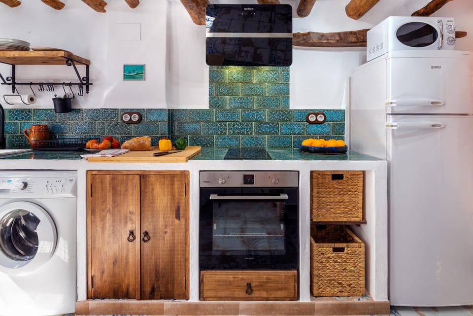 Kitchen or kitchenette, oven, stove, toaster, washing machine