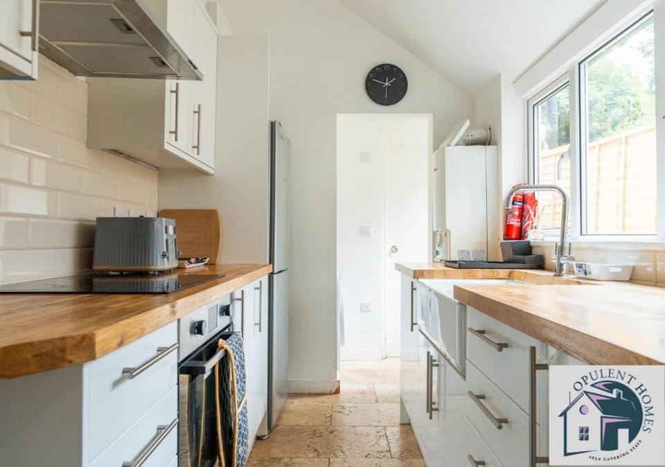 Kitchen or kitchenette, dishwasher, stove, toaster