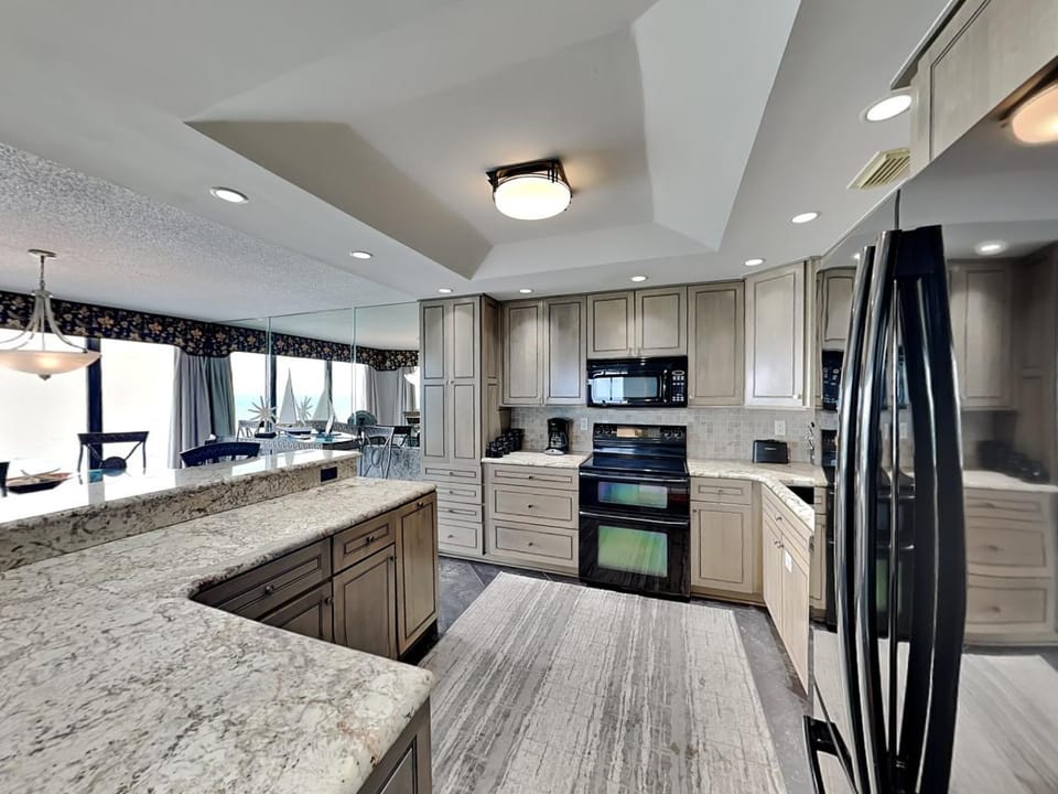 Kitchen or kitchenette, microwave, oven, stove, kitchen