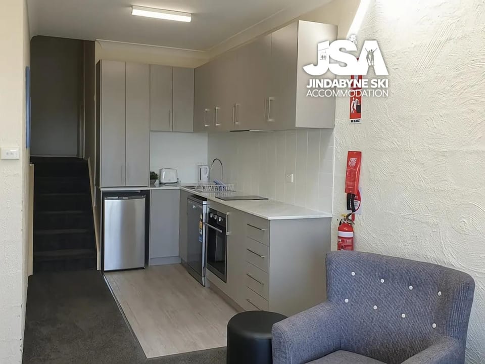 Kitchen or kitchenette, dishwasher, oven, stove
