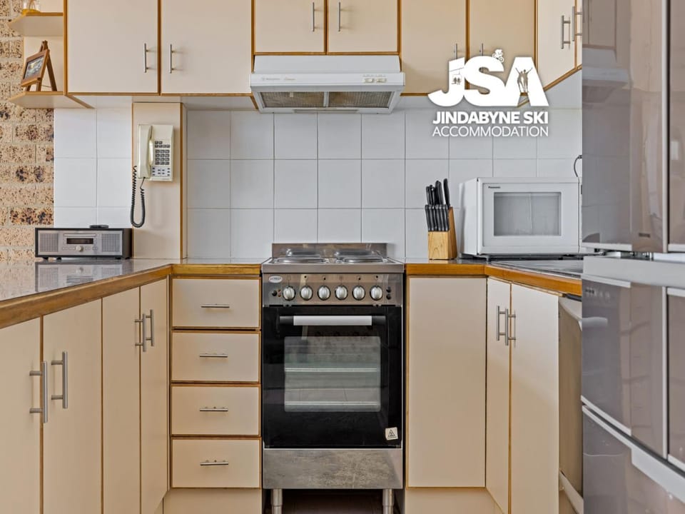 Kitchen or kitchenette, dishwasher, oven, stove, toaster