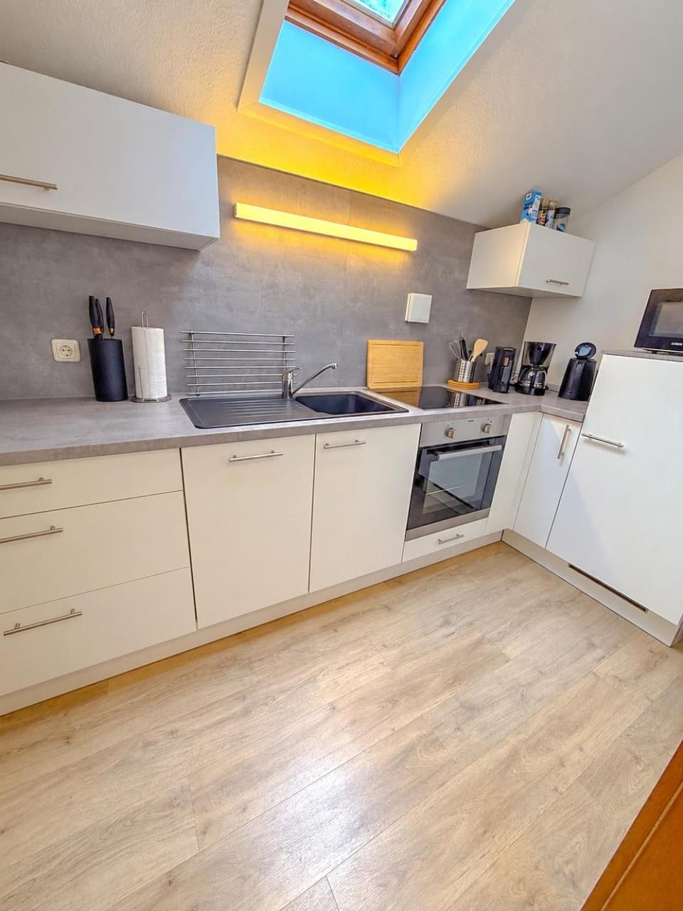 Kitchen or kitchenette, dishwasher, oven, stove