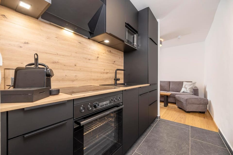 Kitchen or kitchenette, dishwasher, oven, stove