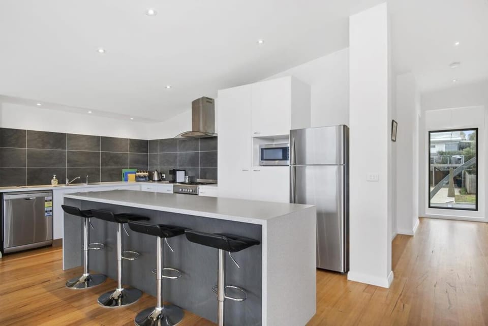 Kitchen or kitchenette, dishwasher, oven, stove