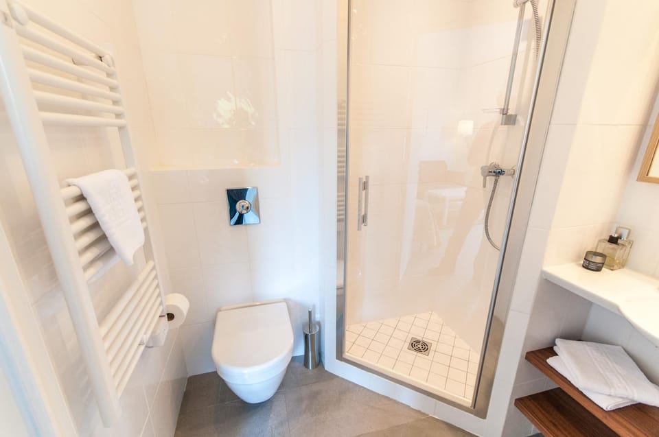 Shower, Toilet, Bathroom, hair dryier, towels