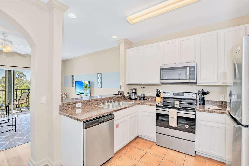 Kitchen or kitchenette, dishwasher, oven, stove