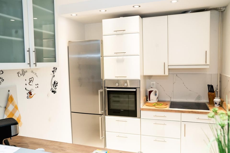 Kitchen or kitchenette, dishwasher, oven, stove