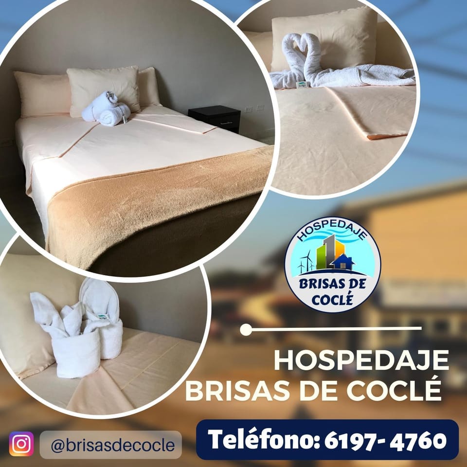 Bed, Property logo or sign, Photo of the whole room, Logo/Certificate/Sign, Bedroom, Text overlay, towels