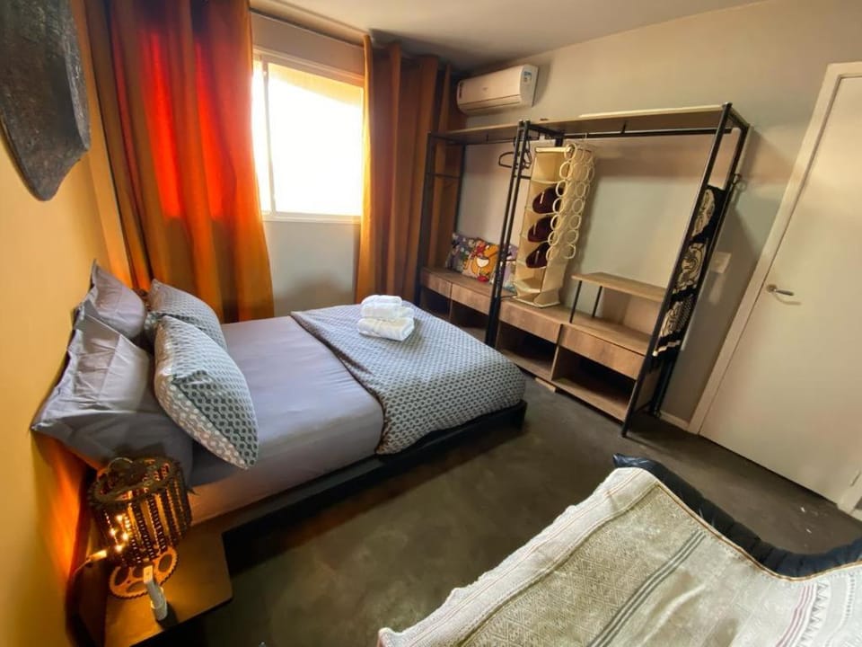 Bed, Photo of the whole room, Seating area, Bedroom, towels, wardrobe, air conditioner