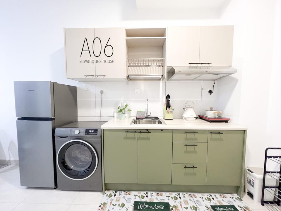 Kitchen or kitchenette, stove, washing machine, dryer