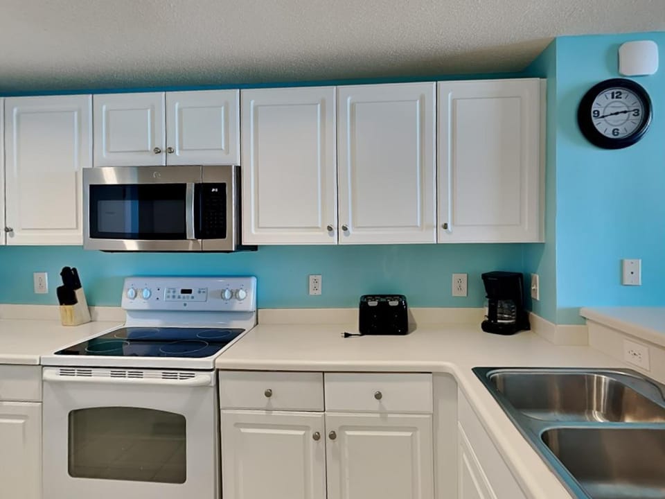 Kitchen or kitchenette, microwave, oven, stove, toaster