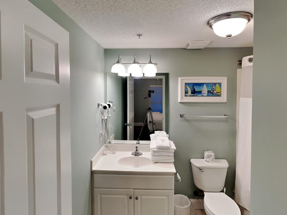Toilet, Bathroom, hair dryier, towels