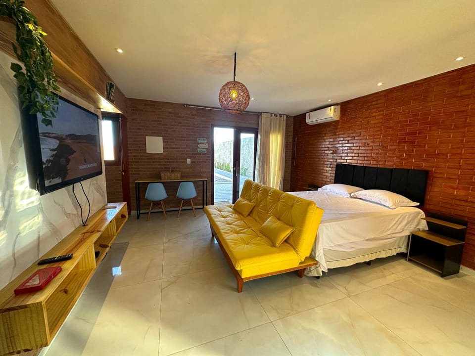 Communal lounge/ TV room, Bed, TV and multimedia, Living room, Photo of the whole room, Seating area, Evening entertainment, Bedroom, air conditioner