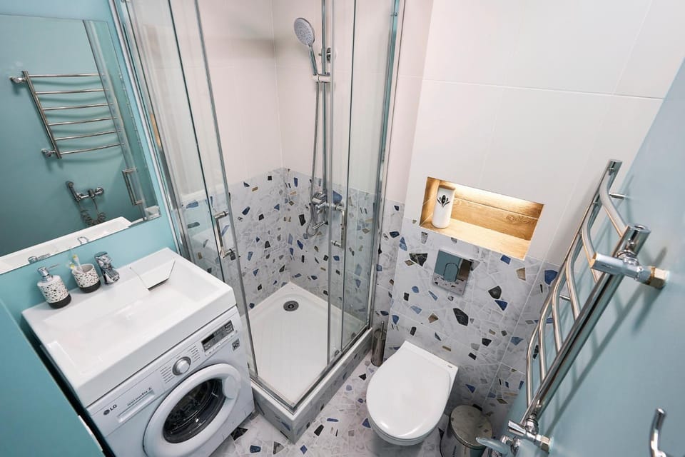 Shower, Toilet, bidet, towels, washing machine, dryer