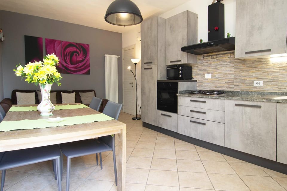 Kitchen or kitchenette, dishwasher, oven, stove