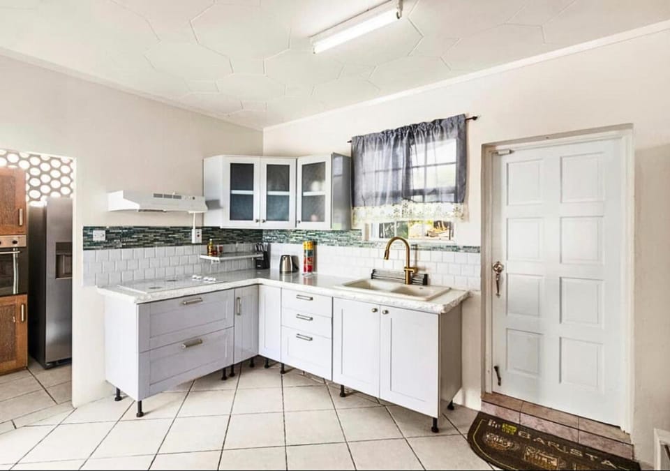 Kitchen or kitchenette, microwave, stove, kitchen, air conditioner