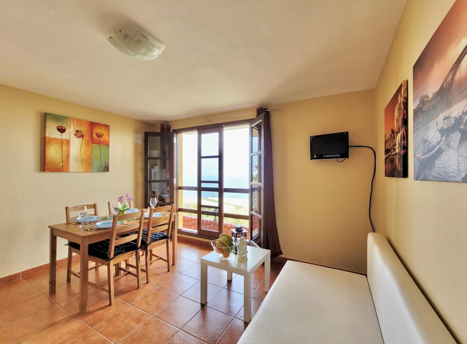 TV and multimedia, View (from property/room), Living room, Seating area, Dining area, Sea view