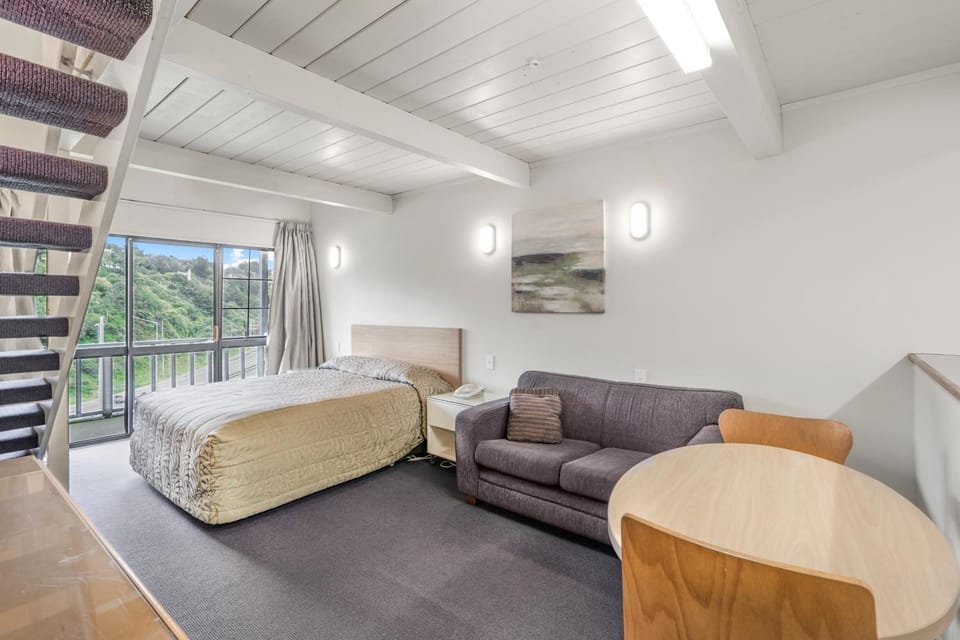 Bed, Living room, Seating area, Bedroom