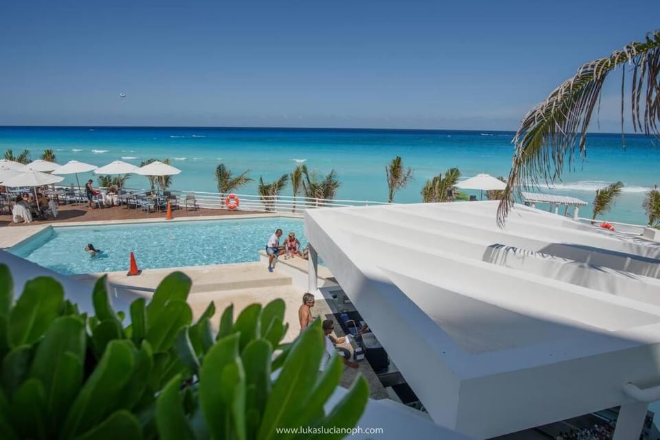 Day, People, Natural landscape, Beach, Pool view, Sea view, Swimming pool, sunbed