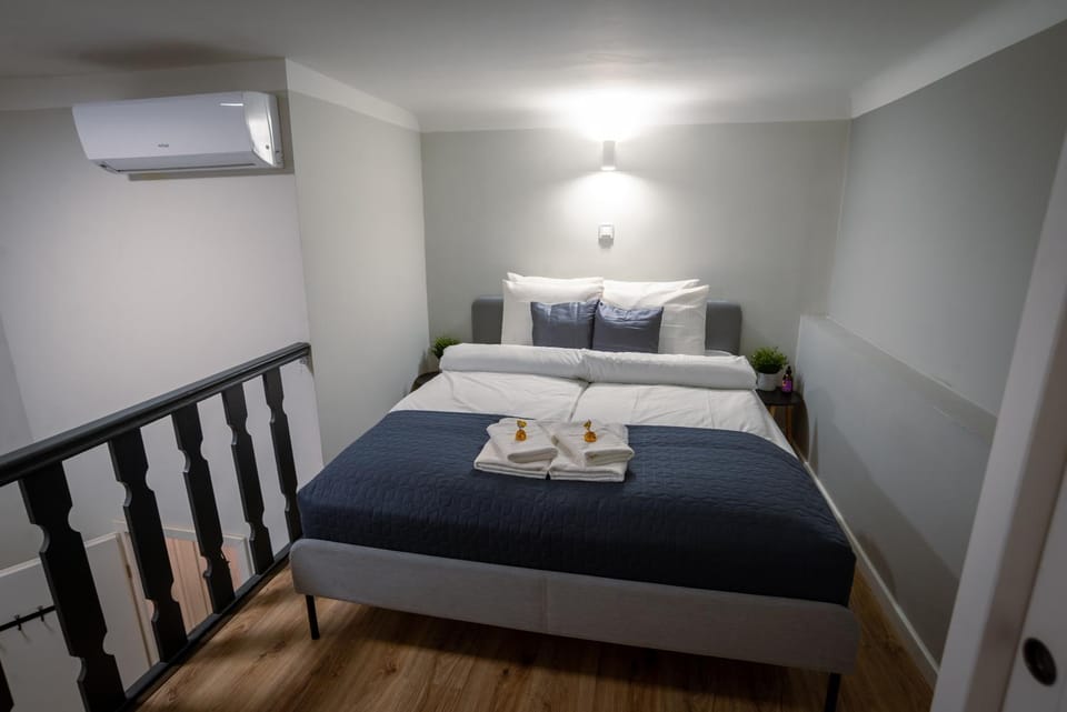 Bed, Photo of the whole room, Bedroom, towels, air conditioner