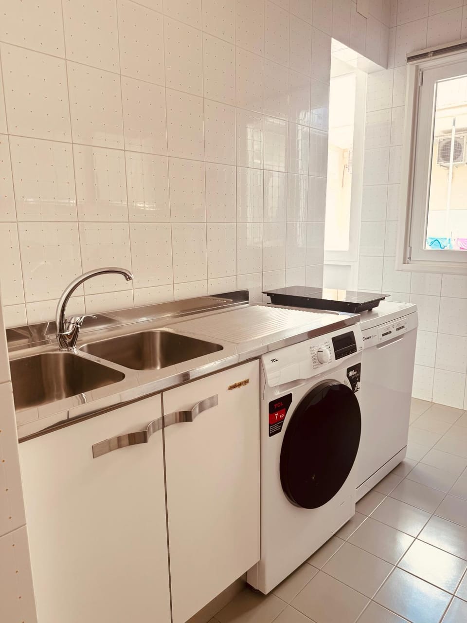 Kitchen or kitchenette, dishwasher, stove, washing machine