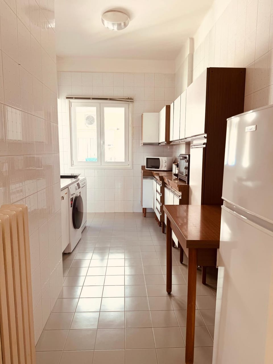 Kitchen or kitchenette, dishwasher, microwave, oven, stove, washing machine