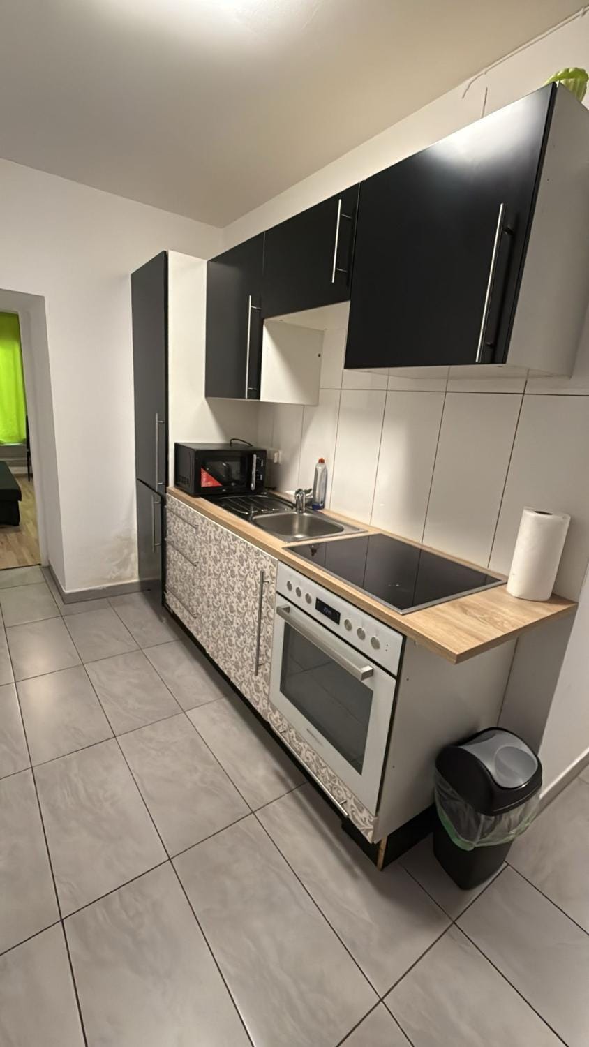 Kitchen or kitchenette, oven, stove