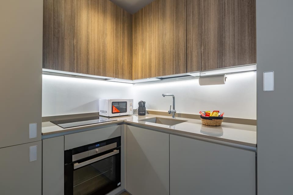 Kitchen or kitchenette, dishwasher, oven, stove, toaster