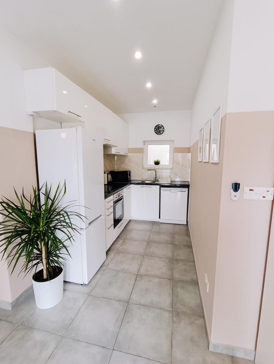 Kitchen or kitchenette, dishwasher, oven, stove