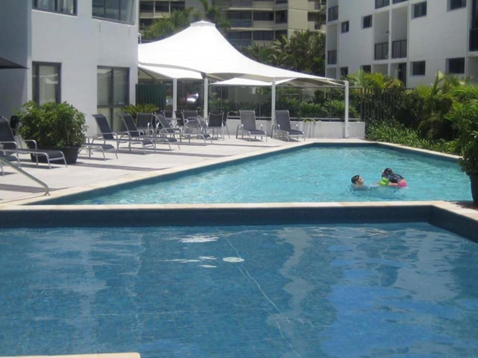 Pool view, Swimming pool, group of guests, sunbed