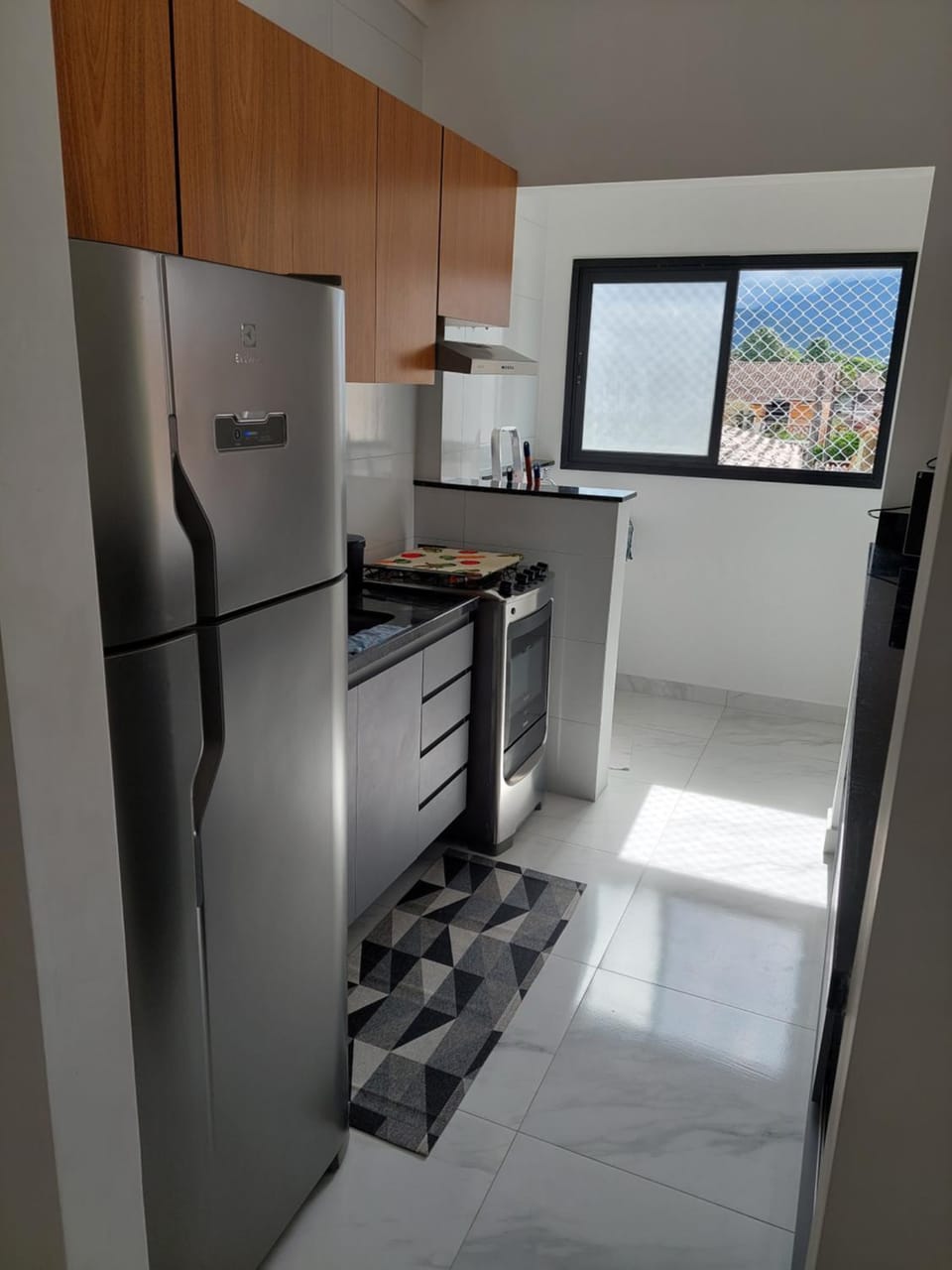 Kitchen or kitchenette, stove, laundry