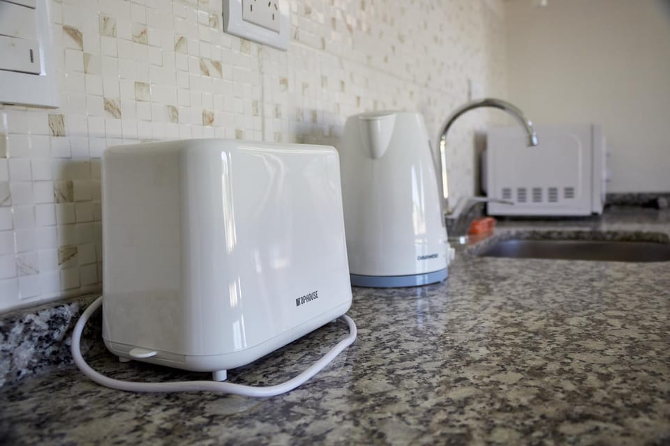 Kitchen or kitchenette, oven, toaster