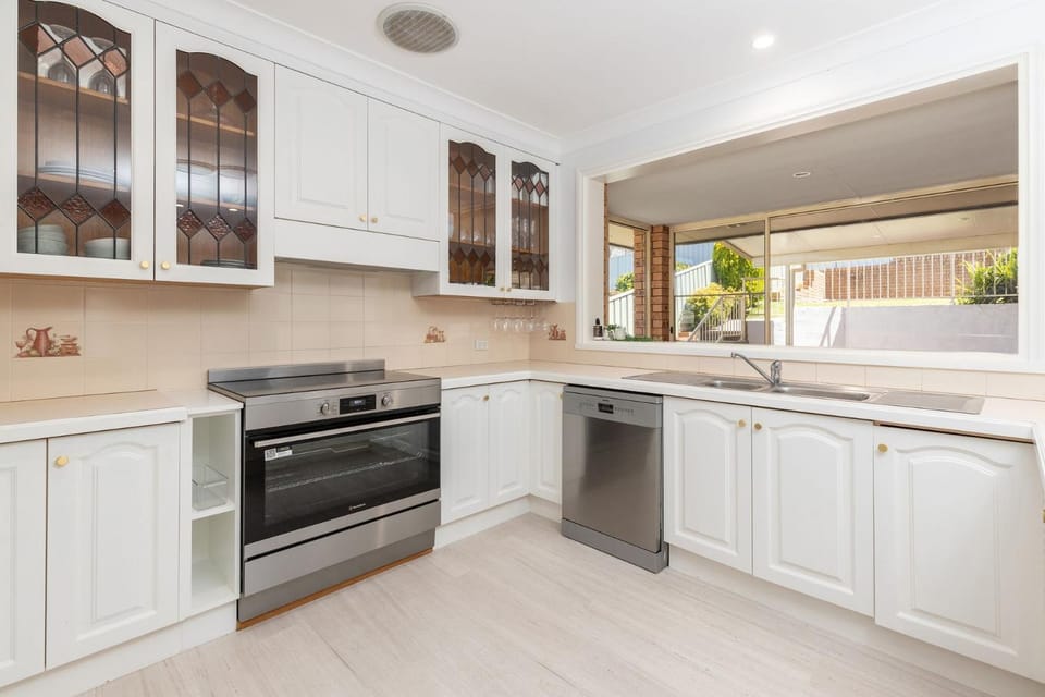 Kitchen or kitchenette, dishwasher, oven, stove