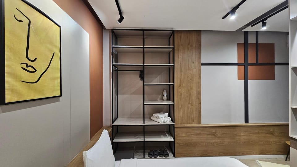 Bed, towels, wardrobe