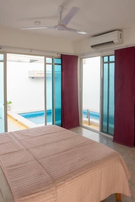 Bed, Photo of the whole room, Bedroom, Pool view, Swimming pool, fireplace, air conditioner