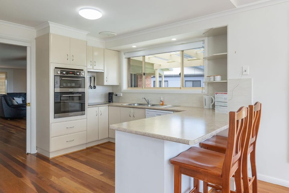 Kitchen or kitchenette, dishwasher, oven, stove