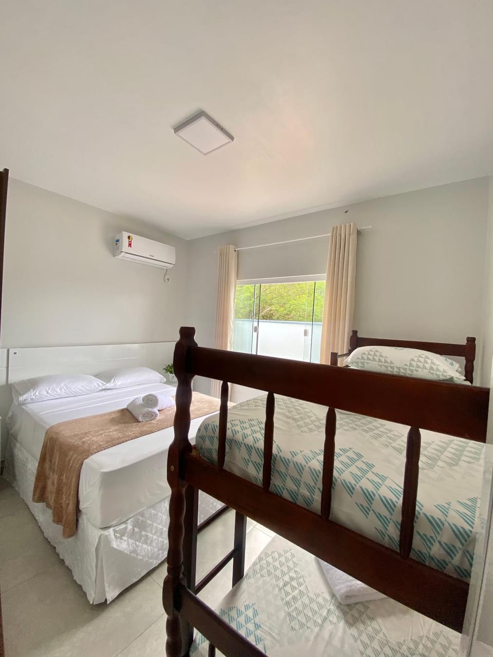 Bed, Photo of the whole room, Bedroom, bunk bed, towels, air conditioner