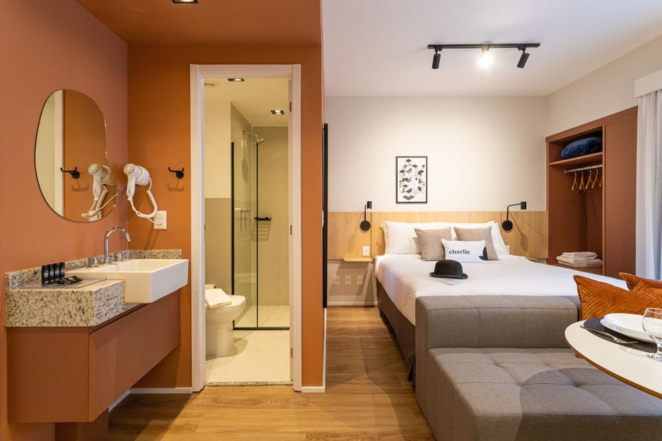 Bed, Day, Bathroom, Living room, Photo of the whole room, Seating area, Dining area, Bedroom, hair dryier, towels, wardrobe