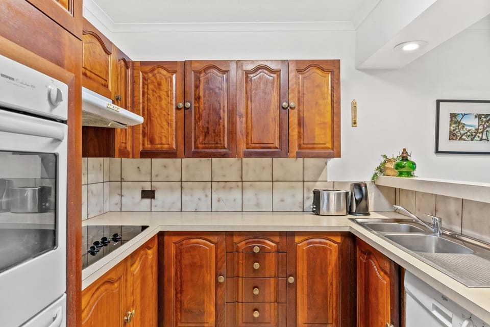 Kitchen or kitchenette, dishwasher, oven, stove, toaster